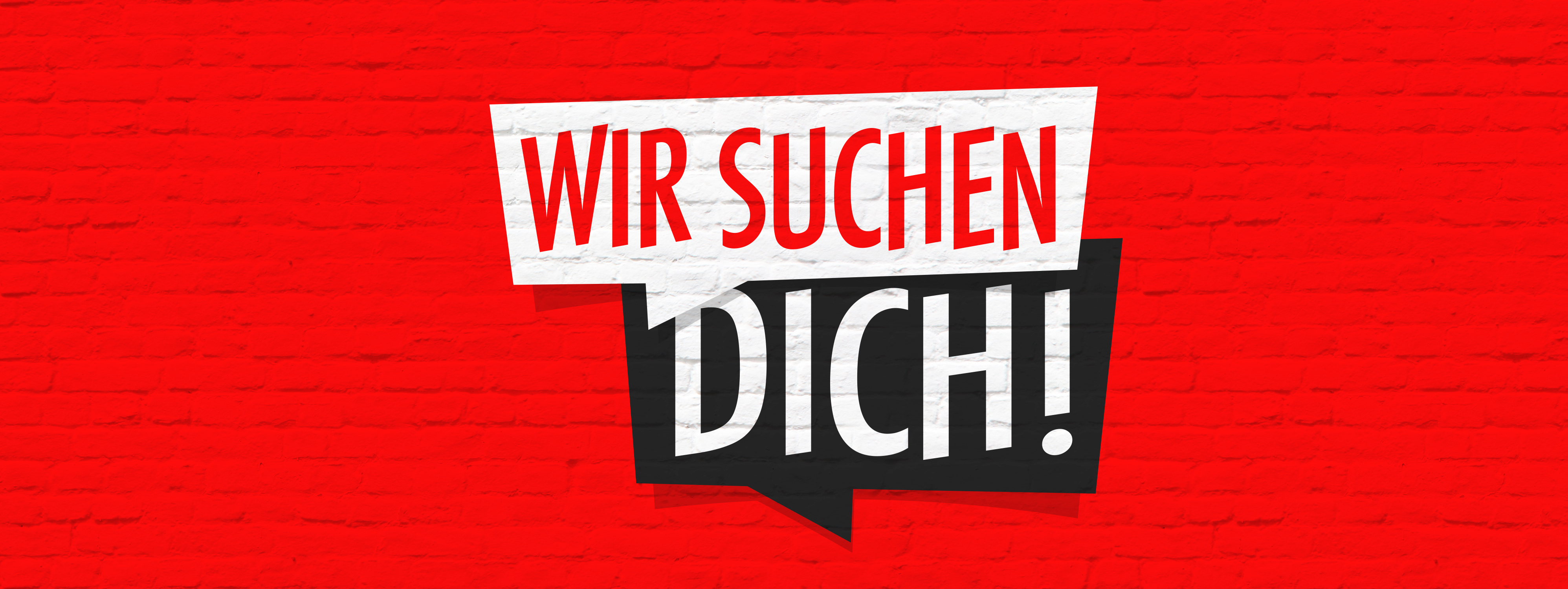 Bild einer knallroten Wand auf der "Wir suchen Dich!" steht 
